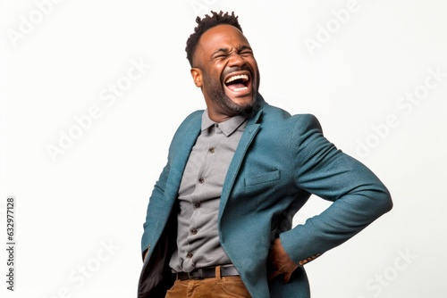 Medium shot portrait photography of a man in his 30s wincing with pain and holding his lower back due to sciatica wearing a chic cardigan against a white background 