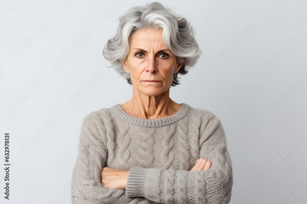 Medium shot portrait photography of a woman in her 50s with a somber and deeply sad expression due to major depression wearing a cozy sweater against a white background Medium shot portrait photography of a woman in her 50s with a somber and deeply sad expression due to major depression wearing a cozy sweater against a white background