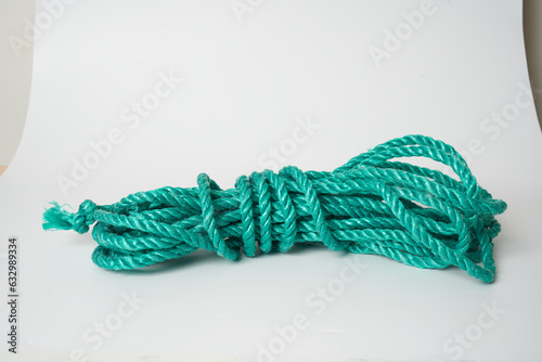 green plastic rope on white background