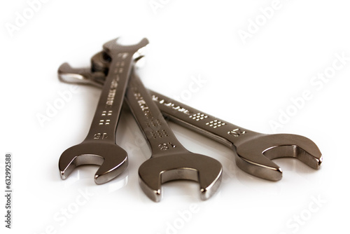 Three open end wrenches isolated on white background. Picture taken in studio with soft-box.