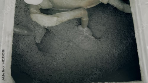 mixing concrete mixture in a large mixer 50fps Slow motion
