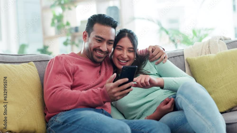 Happy, hug and couple on a sofa with phone for social media, streaming or video subscription in their home. Love, embrace and woman with man and smartphone in a living room for online communication Happy, hug and couple on a sofa with phone for social media, streaming or video subscription in their home. Love, embrace and woman with man and smartphone in a living room for online communication