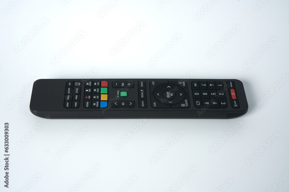 Black tv remote on an isolated white background Black tv remote on an isolated white background