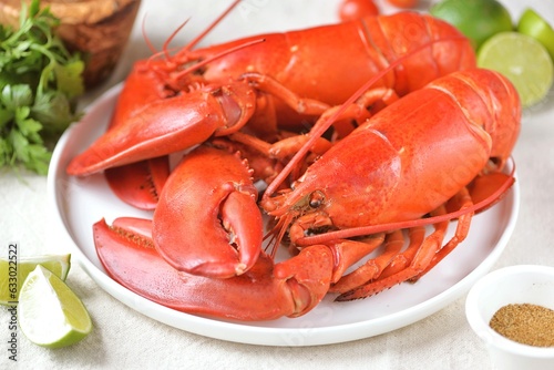 Two boiled lobsters with spices and lime