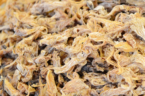 Dried salted fish as a background. Close-up.