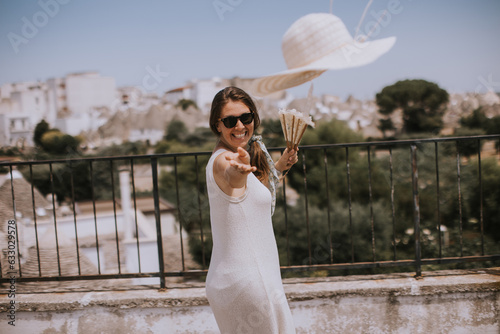 A young woman in a white dr...