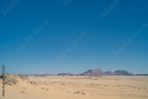 view in the Sahara desert of Tadrart rouge tassili najer in Djanet City   Algeria.colorful orange sand  rocky mountains