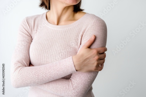 Woman in a pink sweater on a white background. Close-up.