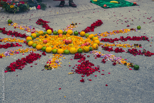 Older woman doing the ritual of thanks for the crops at the Inti Raymi festival photo