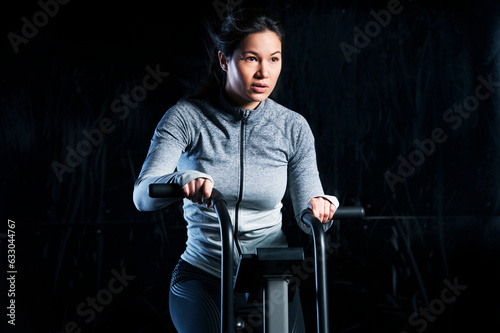 Woman using exercise machine