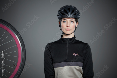 Portrait of young woman wearing bicycle helmet. photo