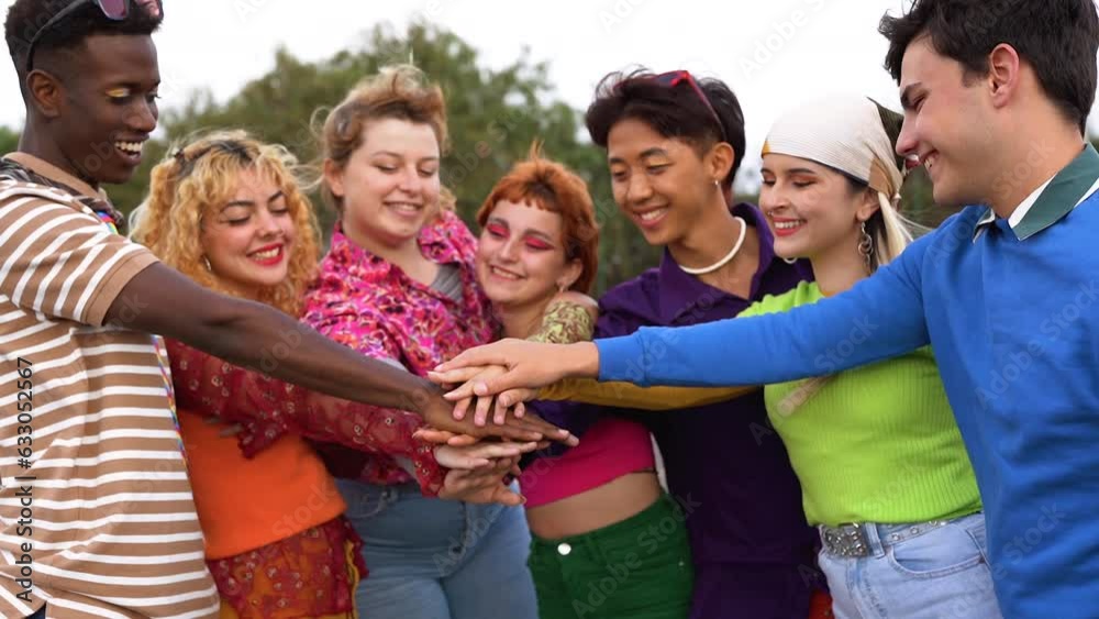 Group of multiethnic friends stacking hands outdoor - Community concept
