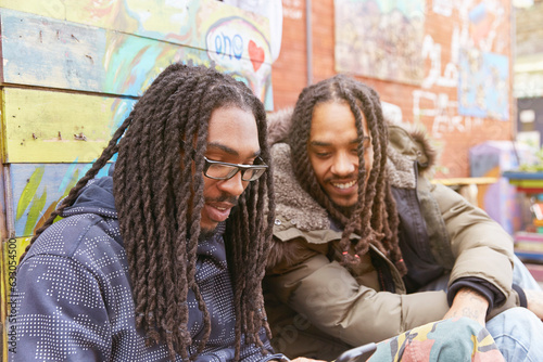 Young men sitting together