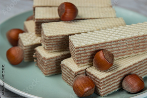 Wafers with nut filling on a plate with hazelnuts