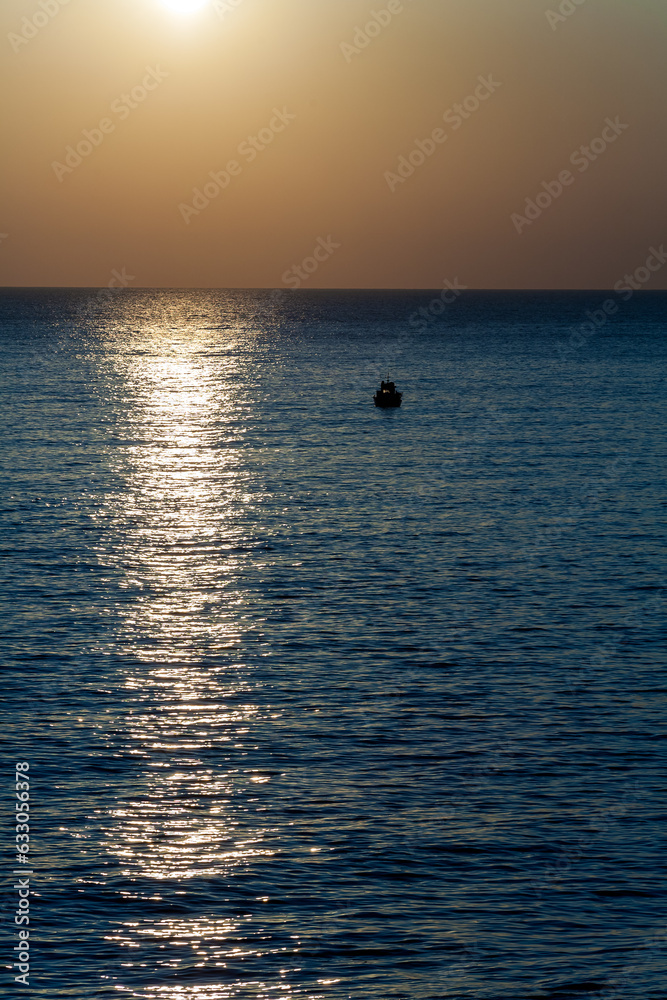 Sunset over fishing boat