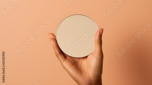 hand holding a mirror