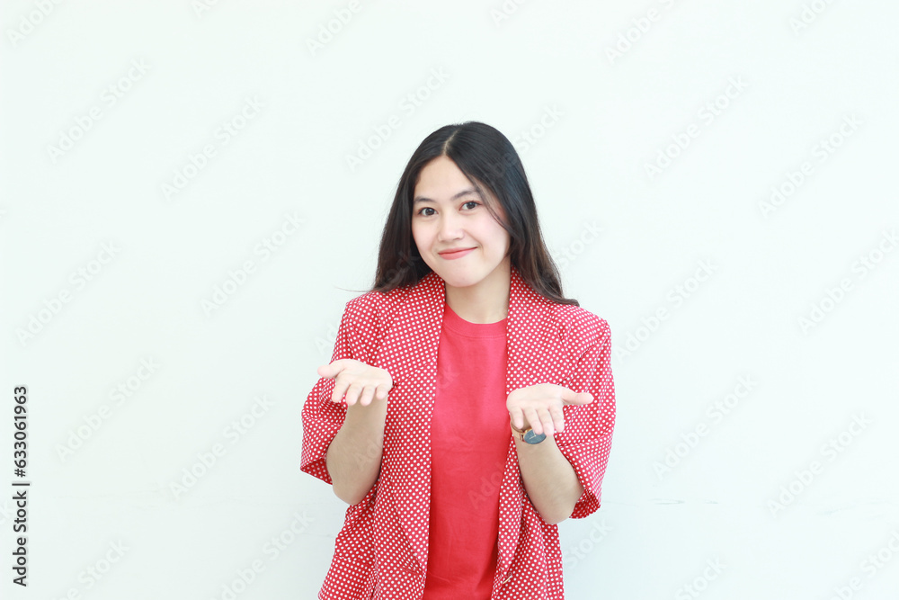 portrait of beautiful asian woman wearing red outfit with hand gesture presenting something or copy space portrait of beautiful asian woman wearing red outfit with hand gesture presenting something or copy space