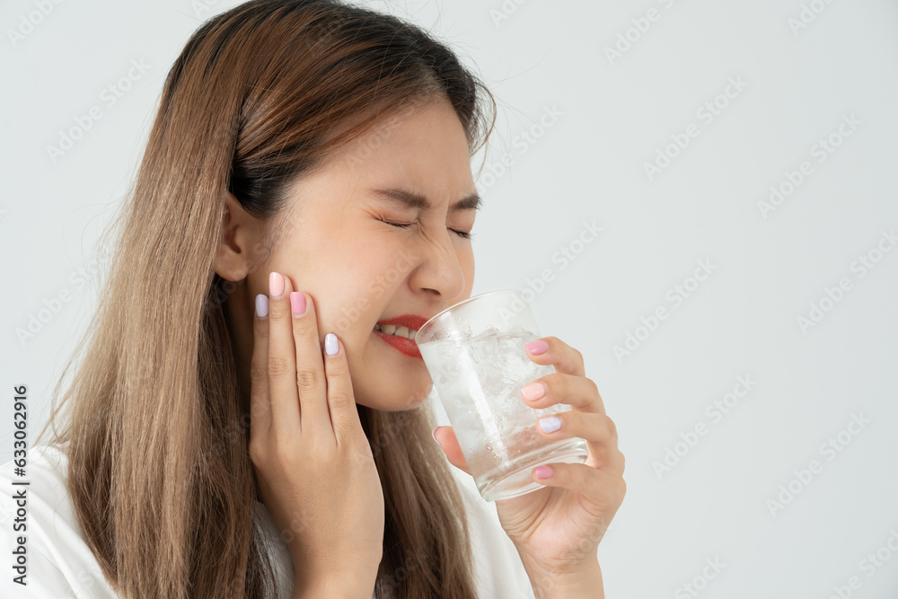 Asian woman feel sensitive teeth after drinking cold, female suffer tooth, decay problems, dental care, tooth extraction, decay problem, bad breath, Gingival Recession, Oral Hygiene instruction Asian woman feel sensitive teeth after drinking cold, female suffer tooth, decay problems, dental care, tooth extraction, decay problem, bad breath, Gingival Recession, Oral Hygiene instruction