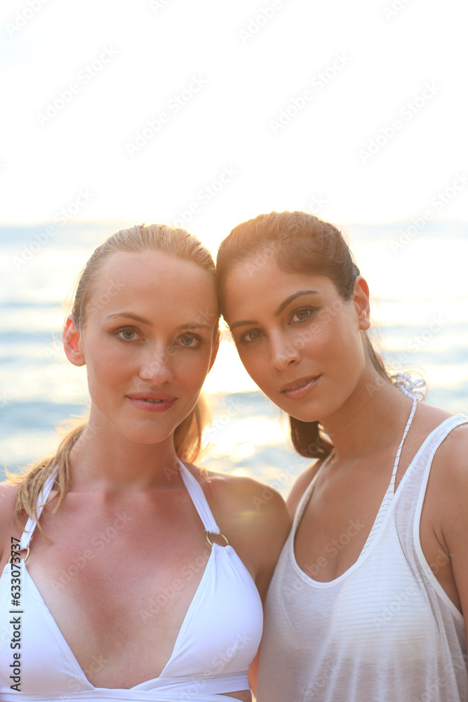 Young women wearing white on beach Young women wearing white on beach
