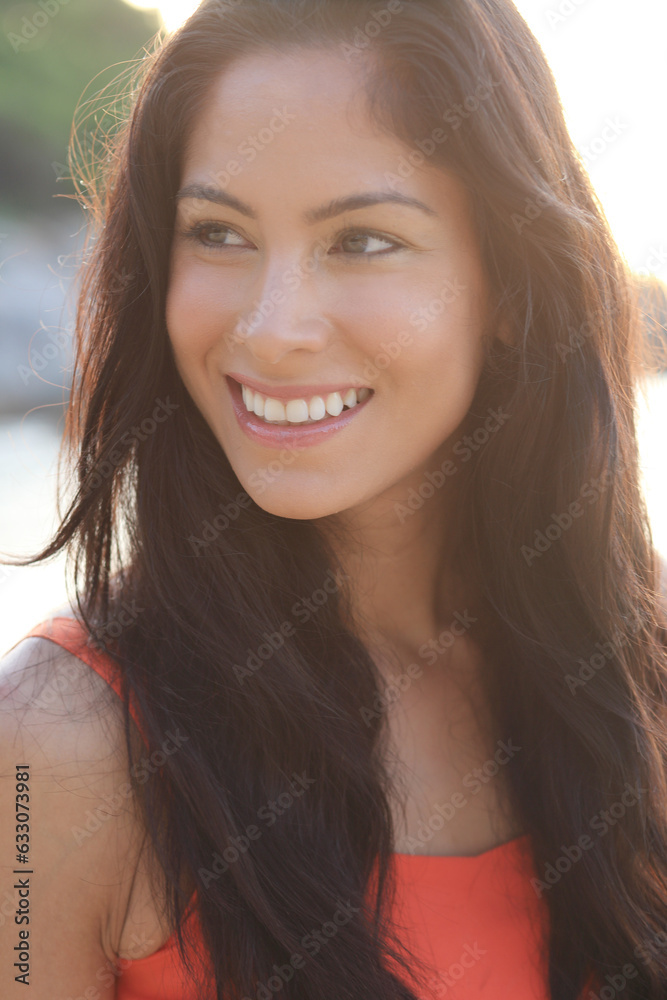 Portrait of young woman with black hair smiling