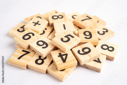 Math number wooden on white background, education study mathematics learning teach concept.