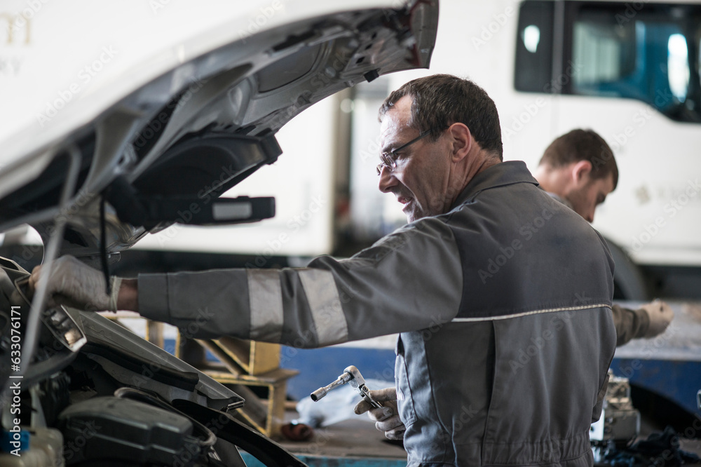 Mechanic working on truck Mechanic working on truck