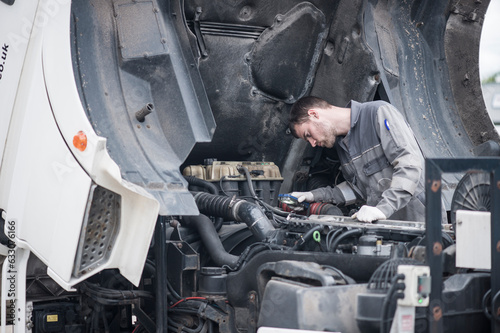 Mechanic working on truck photo