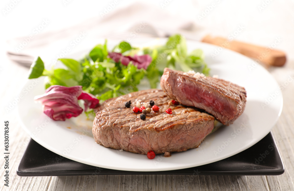 grilled beef steaks with salad