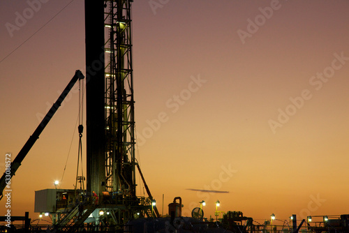 View of drilling rig at sunset