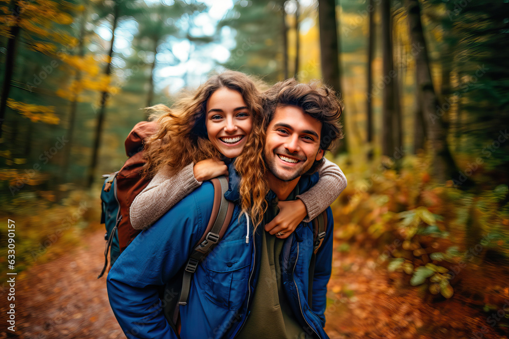 Romantic couple hugging in a forest one autumn morning Romantic couple hugging in a forest one autumn morning