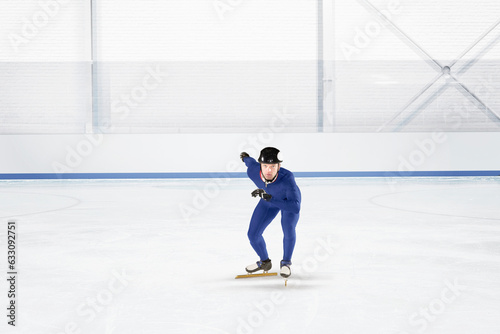 Young man practicing speed skating at ice rink photo