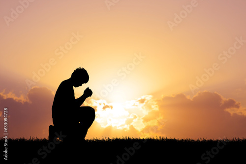 A lonely and desperate man praying to God.