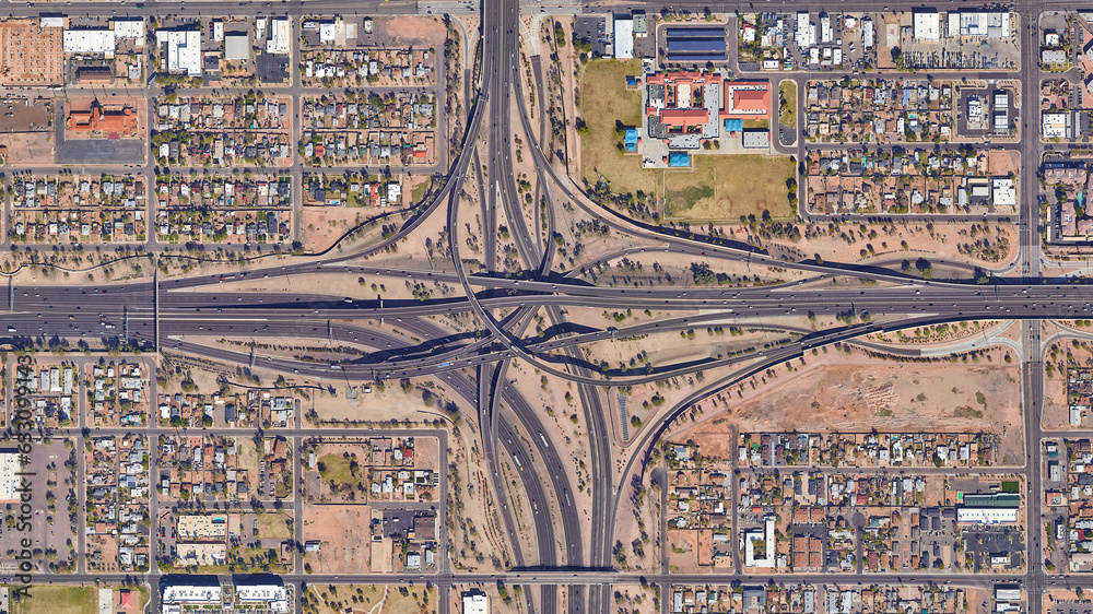 Raod, highway, flyover road junction - spaghetti and roundabout looking down aerial view from above, bird’s eye view expressway and intersection landscape, Phoenix, Arizona, USA