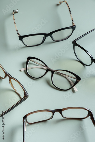 Stylish eyeglasses on colored background. Optical store, vision test, stylish glasses concept.