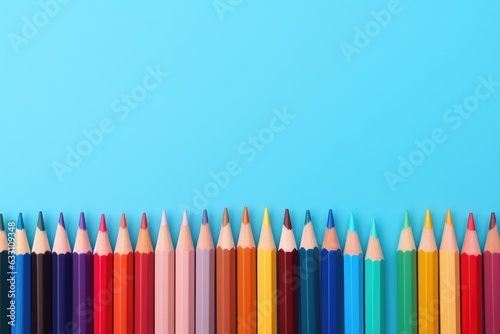 Colored pencils on blue background