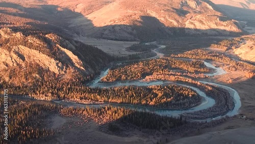 The Chuya meanders are graceful turns of the Chuya riverbed in the Altai Mountains, Siberia,Russia, and the North Chui Ridge, which creates unique landscapes. Aerial view. photo