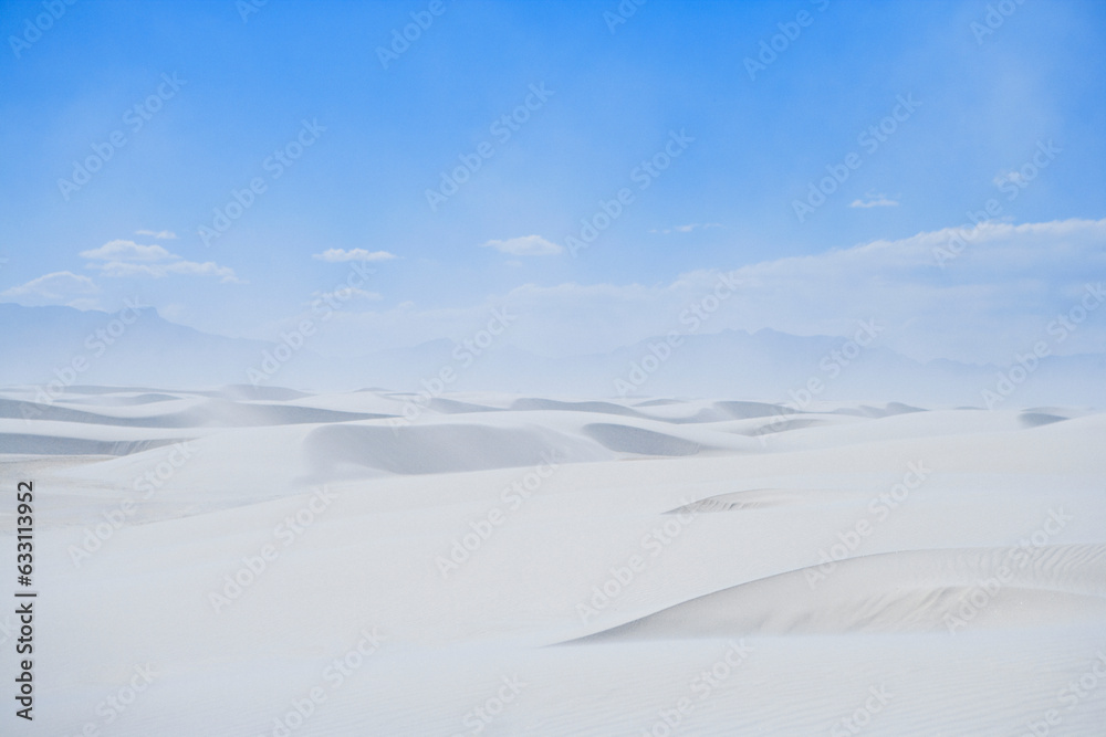 sand dunes in the desert under a blue sky