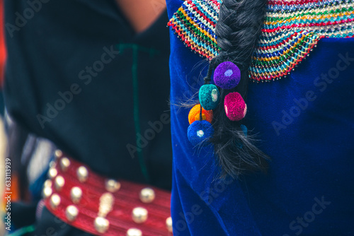 Ornaments that Saraguro women use in their long braids photo