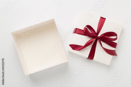 Open gift box on color background, top view. Mock up for design