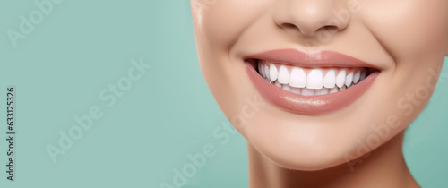 Closeup of Beautiful Smiling Woman with White Teeth on Mint Background