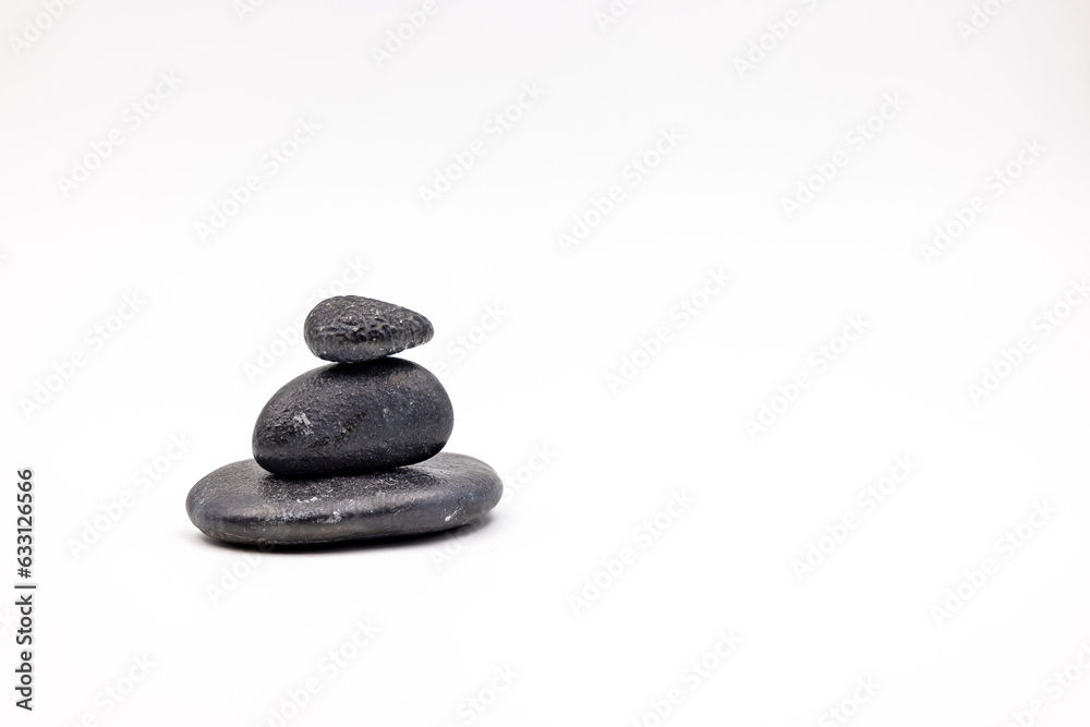 A black cairn cut out on white background A black cairn cut out on white background