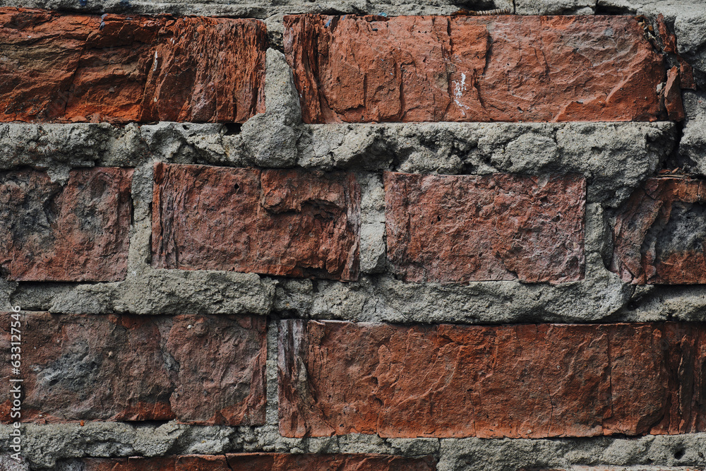 Background, an old crumbling red brick wall. Background, an old crumbling red brick wall.