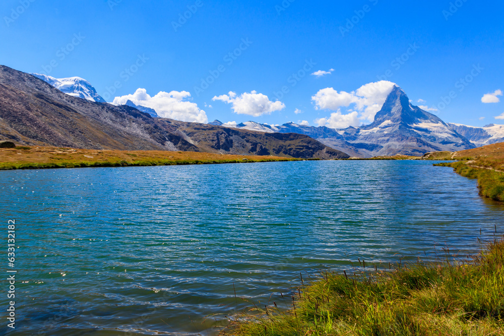 View of Stelli Lake (Stellisee) and Matterhorn mountain at summer in Zermatt, Swiss Alps, Switzerland View of Stelli Lake (Stellisee) and Matterhorn mountain at summer in Zermatt, Swiss Alps, Switzerland