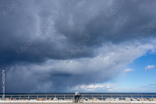 Fototapeta Naklejka Na Ścianę i Meble -  bicycle trip, stormy weather, clouds