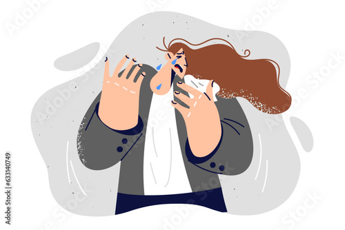 Crying woman stands with handkerchief in hand and suffers from psychological stress and depression