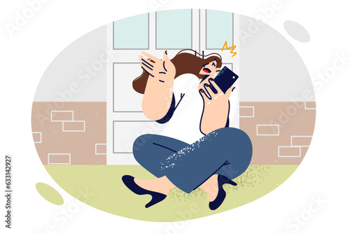 Woman making phone call sits on porch of house near door and chats with friend discussing news