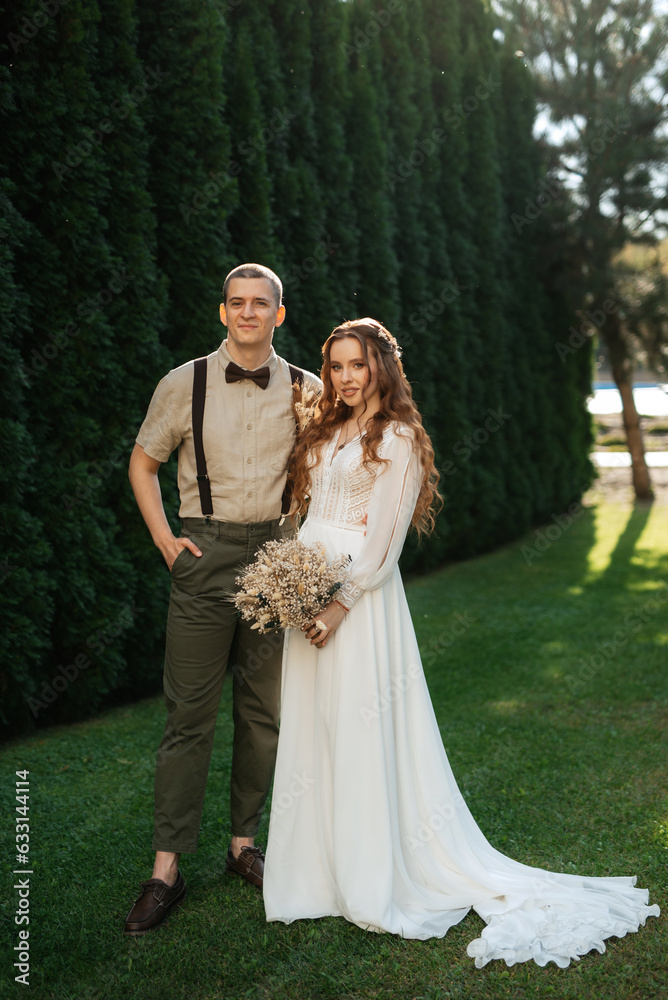 wedding walk of the bride and groom in a coniferous wedding walk of the bride and groom in a coniferous