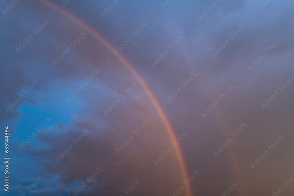 Rainbow in the rain against a beautiful sky Rainbow in the rain against a beautiful sky