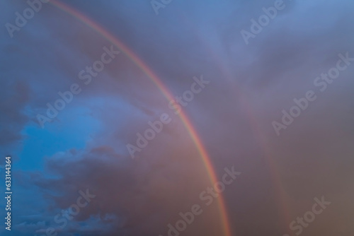 Rainbow in the rain against a beautiful sky © Алексей Божко