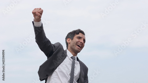 Business man with fist up on white background